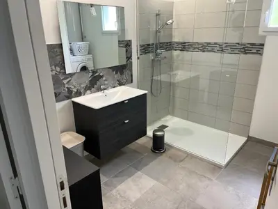 a bathroom with a shower and a sink and a tub at Casa San Stefanu in Olmeta-di-Tuda