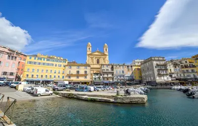 a city with cars parked next to a river at 1 Bedroom Awesome Home In Vignale in Vignale
