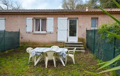 a table and chairs in front of a house at 1 Bedroom Awesome Home In Vignale in Vignale