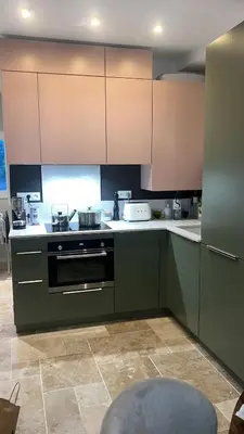 a kitchen with green cabinets and a stove at A Casa Laetizia in Eccica-Suarella
