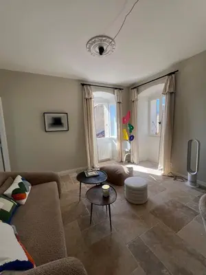 a living room with a couch and a table at A Casa Laetizia in Eccica-Suarella