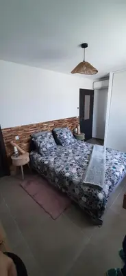 a bedroom with a bed in a room at Chez bigoudy in Penta-di-Casinca