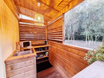 a small kitchen with a sink and a window at Studio à Bonifacio in Bonifacio