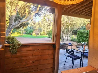 a screened in porch with a view of a patio at Studio à Bonifacio in Bonifacio