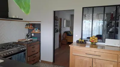 a kitchen with a stove and a counter top at Charmant cosy T3 in Ajaccio