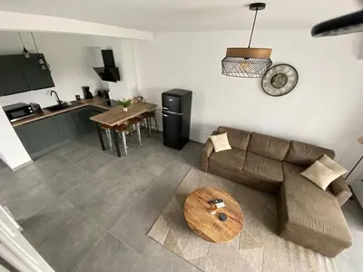 a living room with a couch and a table at Casa linsia in Aléria