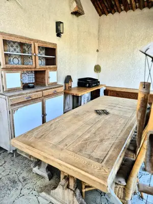 a kitchen with a wooden table in a room at A Bella Gaia in Cauro