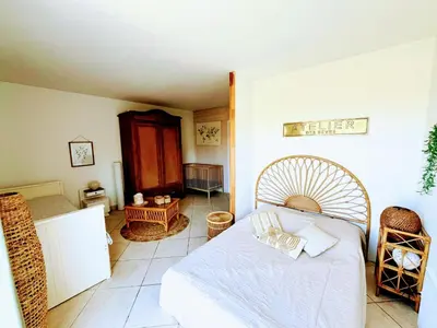 a bedroom with a bed with a white bedspread at A Bella Gaia in Cauro