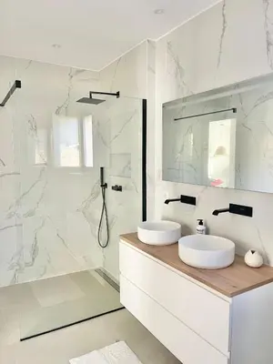 a white bathroom with two sinks and a shower at Villa vue montagne - 8 pers in Sotta