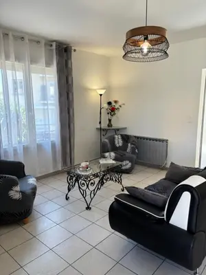 a living room with couches and a coffee table at Pietralba t3 in Ajaccio