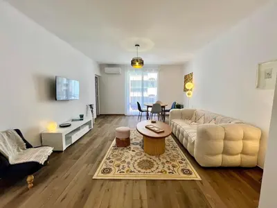 a living room with a couch and a table at Charmant appartement 50 m Plage in Ajaccio