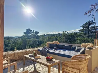 a living room with a couch and a table at Villas Inamorata in Lecci