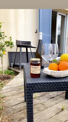 a table with a jar of jam and some oranges at Le Petit paradis in Aregno