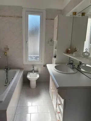 a bathroom with a tub and a sink and a toilet at CHARMANT T3 Pietralba in Ajaccio