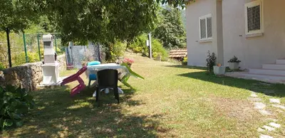 a table in the backyard of a house at Villa Pastriccialone in Afa