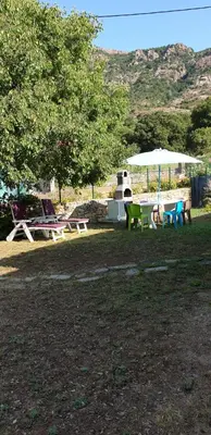 a group of tables and umbrellas in a park at Villa Pastriccialone in Afa