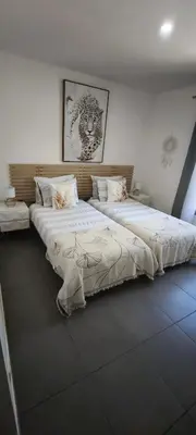 two beds sitting next to each other in a room at Résidence privée avec piscine à Bonifacio in Bonifacio