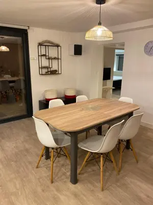 a dining room with a table and chairs at Corse du Sud Villa les pieds dans l'eau ! in Zonza