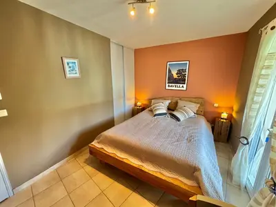 a bedroom with a bed with two pillows on it at Villa à Porto-Vecchio - Résidence privé in Porto-Vecchio
