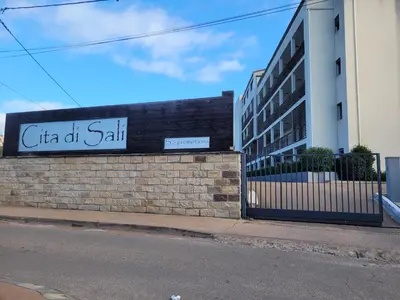 a building with a sign that reads cta oil spill at Studio Port de Porto-Vecchio in Porto-Vecchio