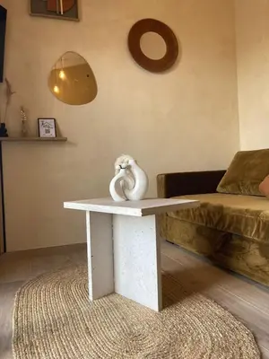 a room with a table with a magazine on it at La mini villa Ondella à Porticcio in Grosseto-Prugna
