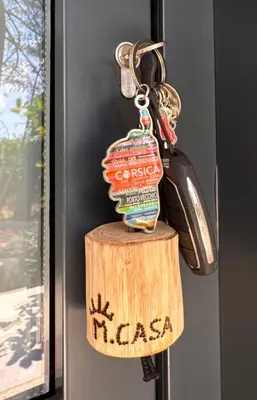 a key chain with a bottle of pasta on it at CASA MILO- with private pool Porto-Vecchio in Porto-Vecchio