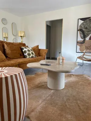 a living room with a coffee table and a couch at Les oliviers in Aléria