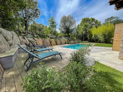 a patio with chairs and a swimming pool at Maison en pierre - 6 personnes - piscine in Porto-Vecchio