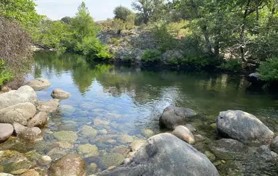 a river with rocks and trees and water at 1 Bedroom Nice Home In Vignale in Vignale