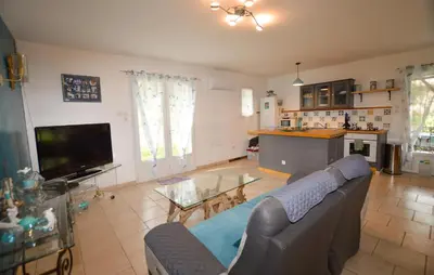 a living room with a couch and a tv at 1 Bedroom Nice Home In Vignale in Vignale
