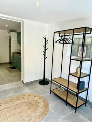 a room with a shelf in the middle of a room at Maison avec jardin et proche mer in Propriano