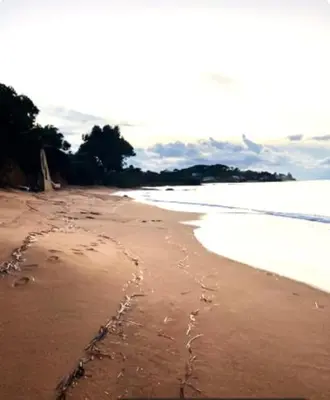 a beach with a heart drawn in the sand at F2 tout confort, les pieds dans l'eau, PORTICCIO in Grosseto-Prugna