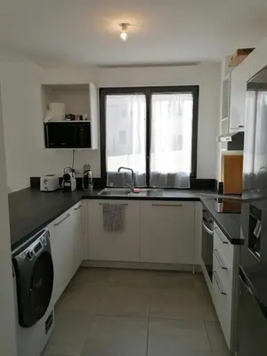 a kitchen with a sink and a counter top at Porticcio grand appartement 3 pièces, 5 minutes de la plage in Porticcio