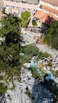 an overhead view of a river with rocks and trees at Hotel Arena le Refuge in Corte