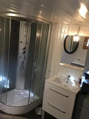 a bathroom with a shower and a sink at yourte de luxe contemporaine in Bonifacio