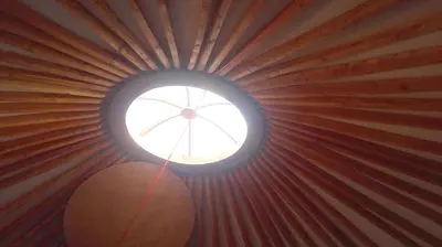 a small window in the ceiling of a tent at yourte de luxe contemporaine in Bonifacio