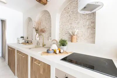 a kitchen with a sink and a counter top at Sublime, hyper-centre d'Ajaccio, avec Spa, Sauna, Vue mer & Plage à 3min in Ajaccio
