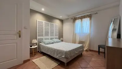 a small bedroom with a bed and a window at Le Gozzi in Afa