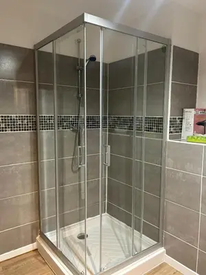 a shower with a glass enclosure in a bathroom at Casa CARLU-MARIA IV in Corte