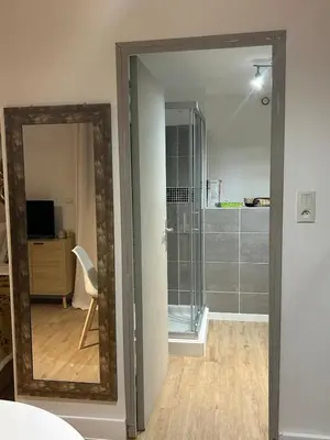 a mirror in a room with a bathroom at Casa CARLU-MARIA IV in Corte