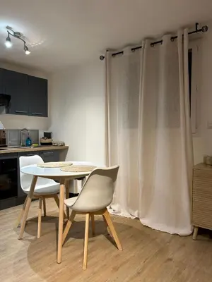 a kitchen with a table and chairs in a room at Casa CARLU-MARIA IV in Corte