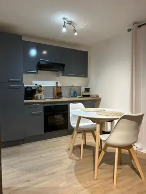 a kitchen with a table and chairs in a room at Casa CARLU-MARIA IV in Corte