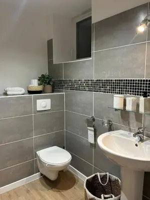 a bathroom with a toilet and a sink at Casa CARLU-MARIA IV in Corte