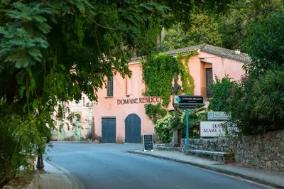 a street in a town with a pink building at U citraghju in Feliceto