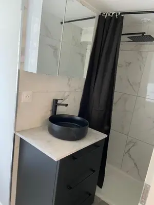 a bathroom with a sink and a shower at Sottu à a Citadella in Corte