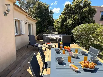 a blue table with food on a patio at Villa 3 chambres dans résidence avec piscine in Porto-Vecchio