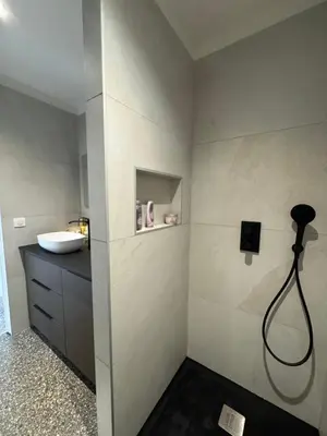 a bathroom with a sink and a shower at La petite maison Corse in Porto-Vecchio
