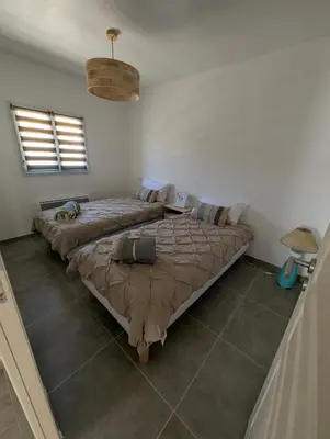 a bedroom with two beds in a room at Casa Orizonte, Viggianello in Viggianello