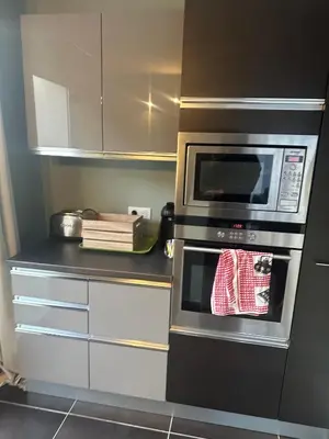a kitchen with a stove and a microwave at Studio avec jardin Route des sanguinaires Barbicaja in Ajaccio