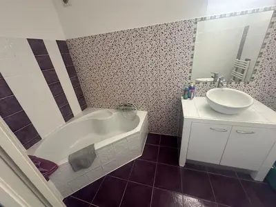 a bathroom with a white tub and a sink at Studio avec jardin Route des sanguinaires Barbicaja in Ajaccio
